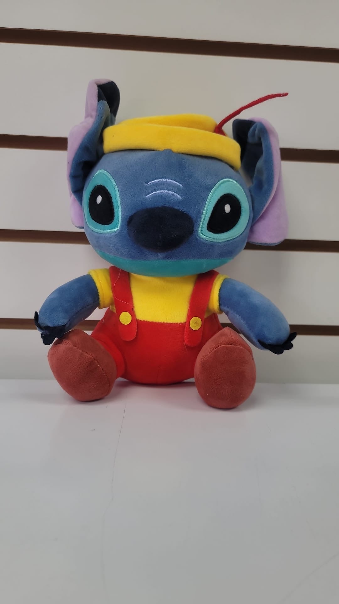 Plush stitch with red overalls