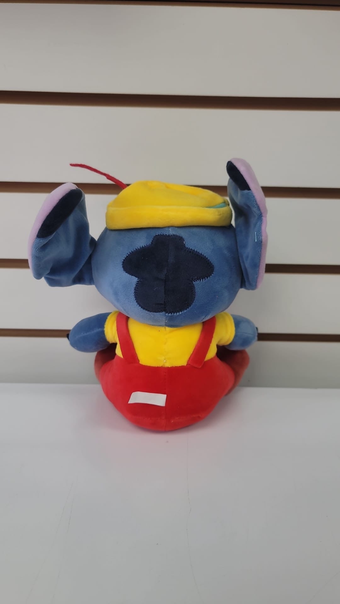 Plush stitch with red overalls